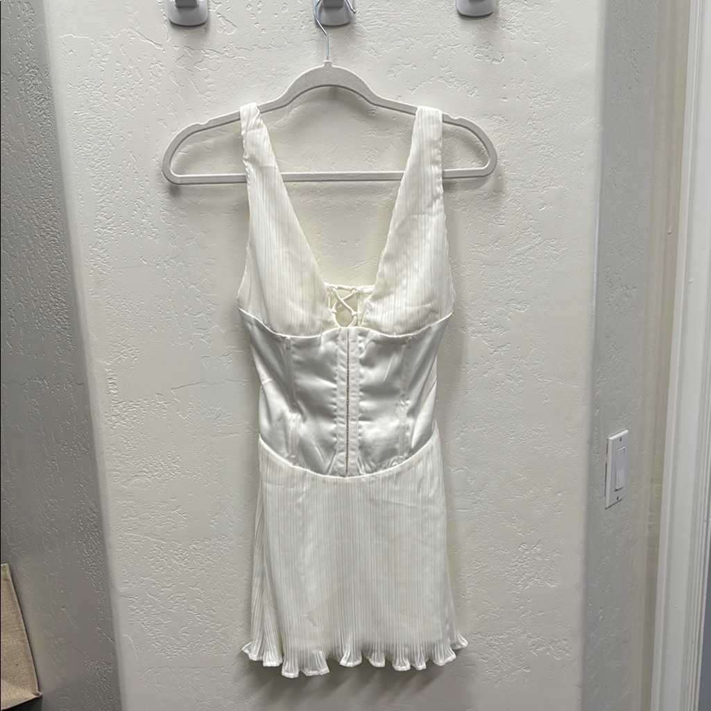 White Mini Dress With Spaghetti Straps And Ruffle Hem